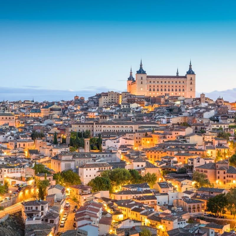 Toledo cathedral on the skyline, lit up at night