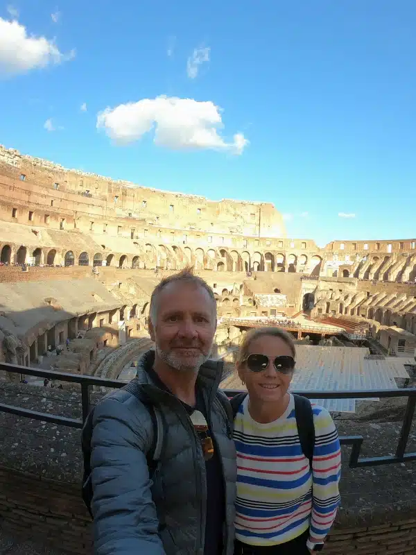 couple standing in from of the inner Colosseum