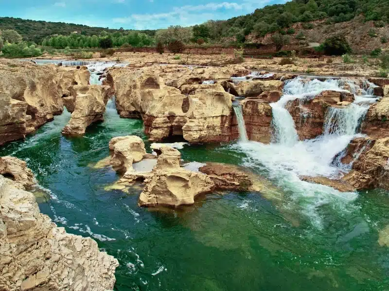 water cascading across and through sandstone rock formations