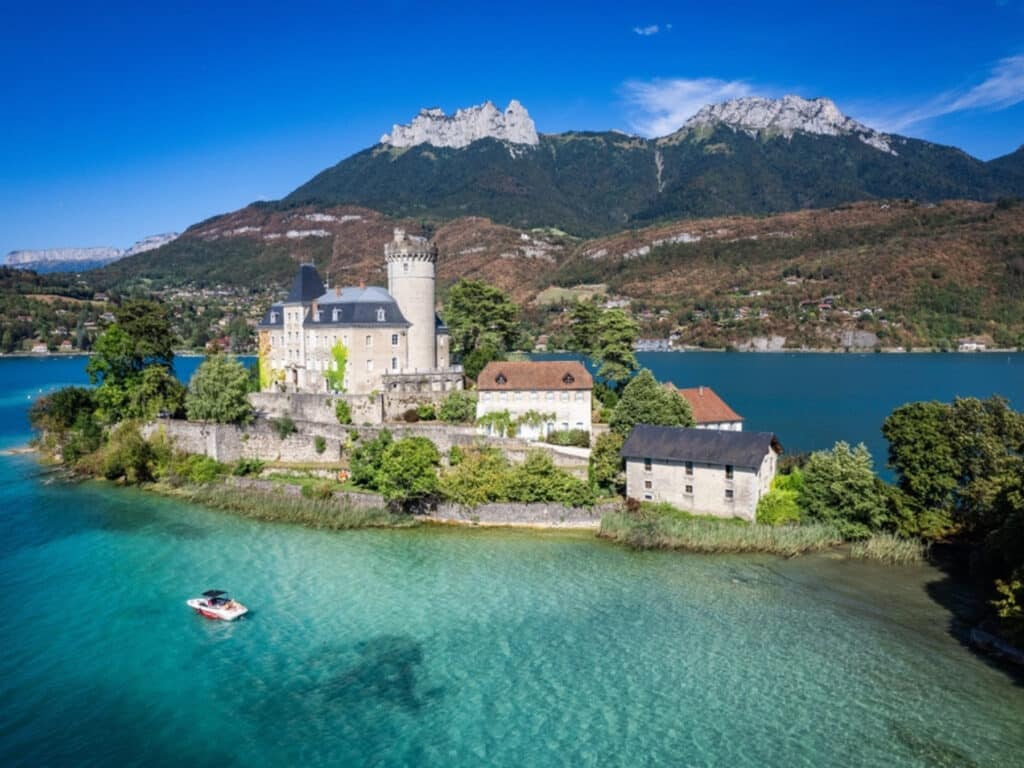 Aerial view of Duingt castle or Chateau de Duingt in Annecy lake, Haute Savoie, France