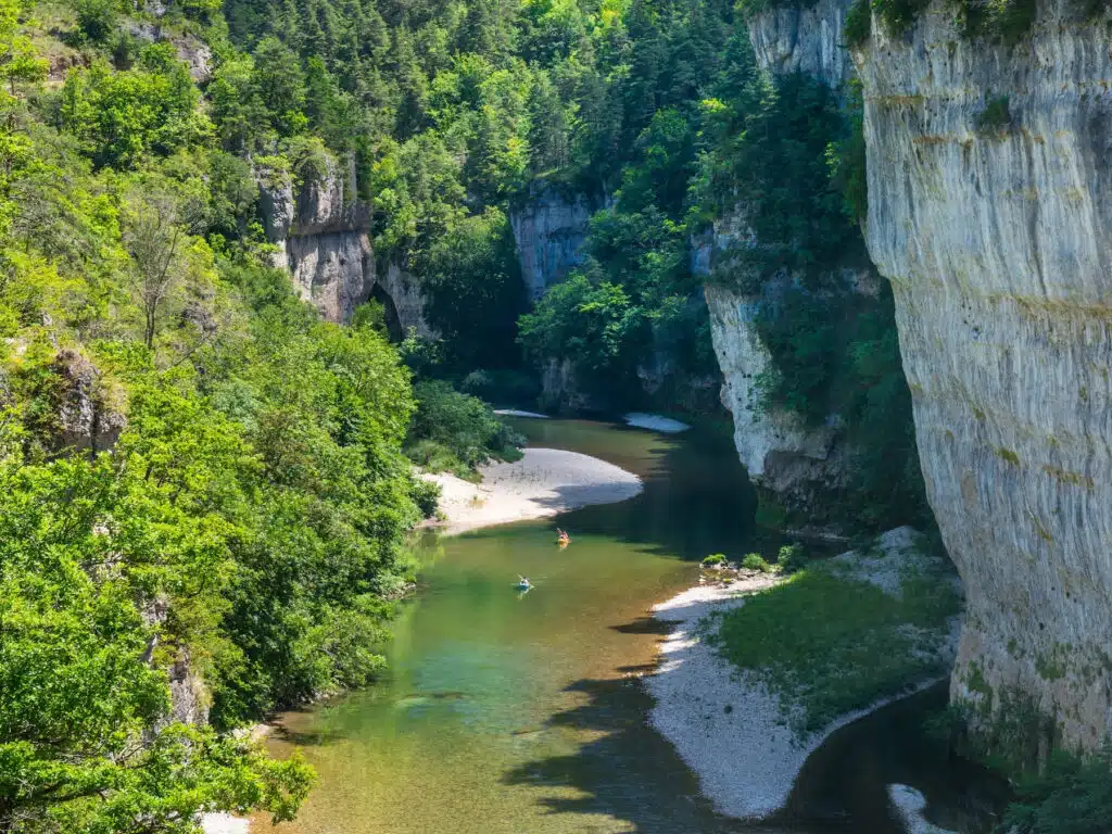 river running through a steep sided gorge with trees on the banks