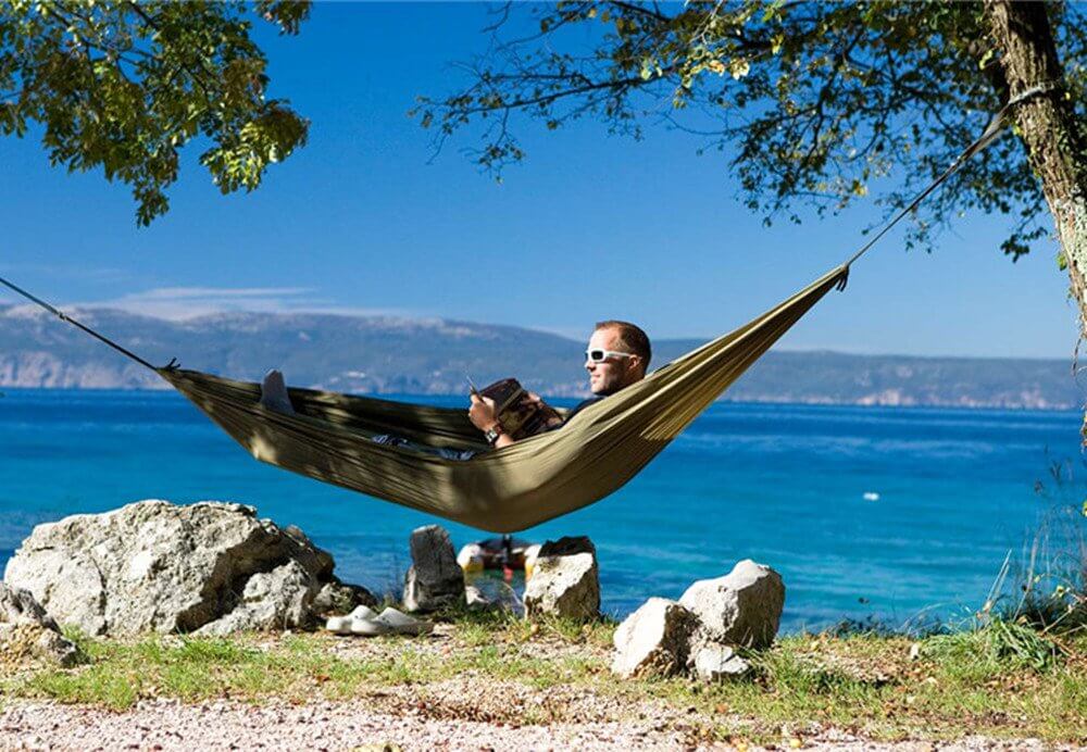 Motorhome life in a hammock, one of the top glamping gadgets