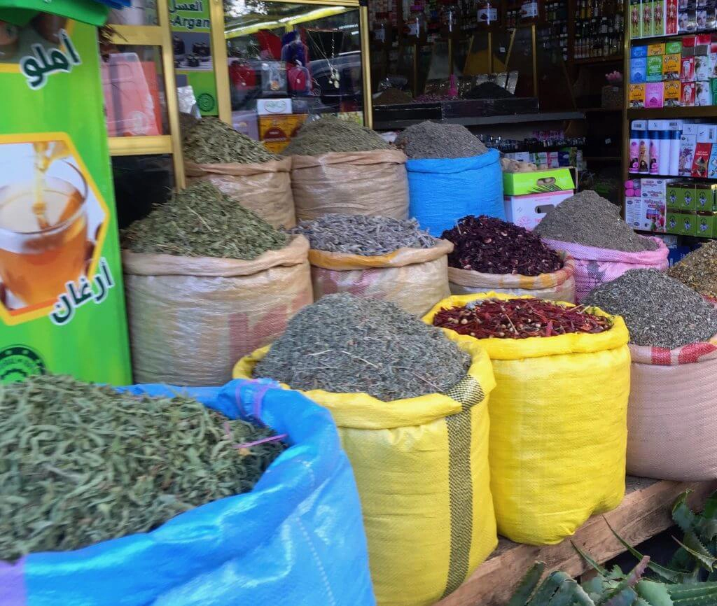 colourful bags of spices for sale ina. Moroccan souk