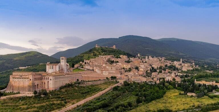 a small religious hilltop town in Italy with a vast basilica