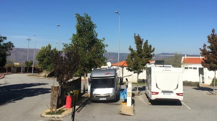 Two campervans using a motorhome service point in Portugal