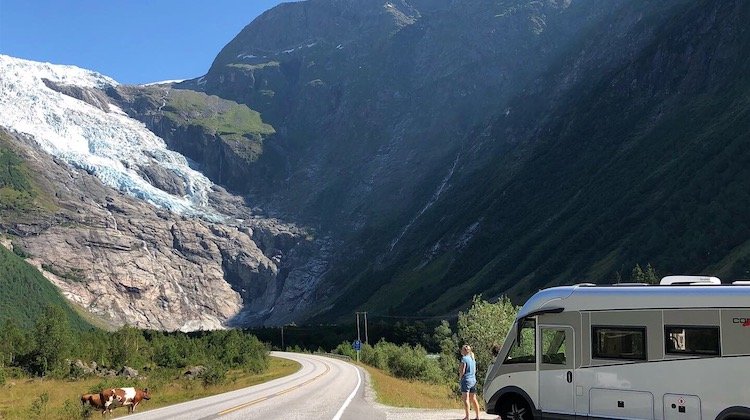motorhome by a road at the foot of a glacier in the Western Fjords