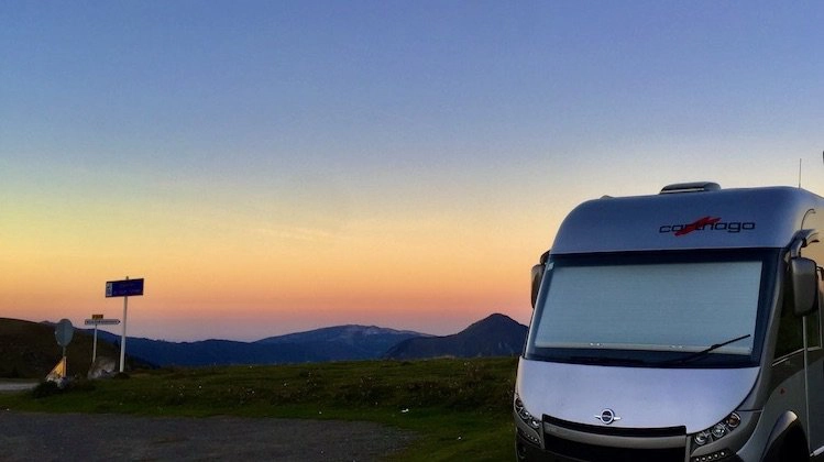 motorhome wild camping in France mountains with orange sunset