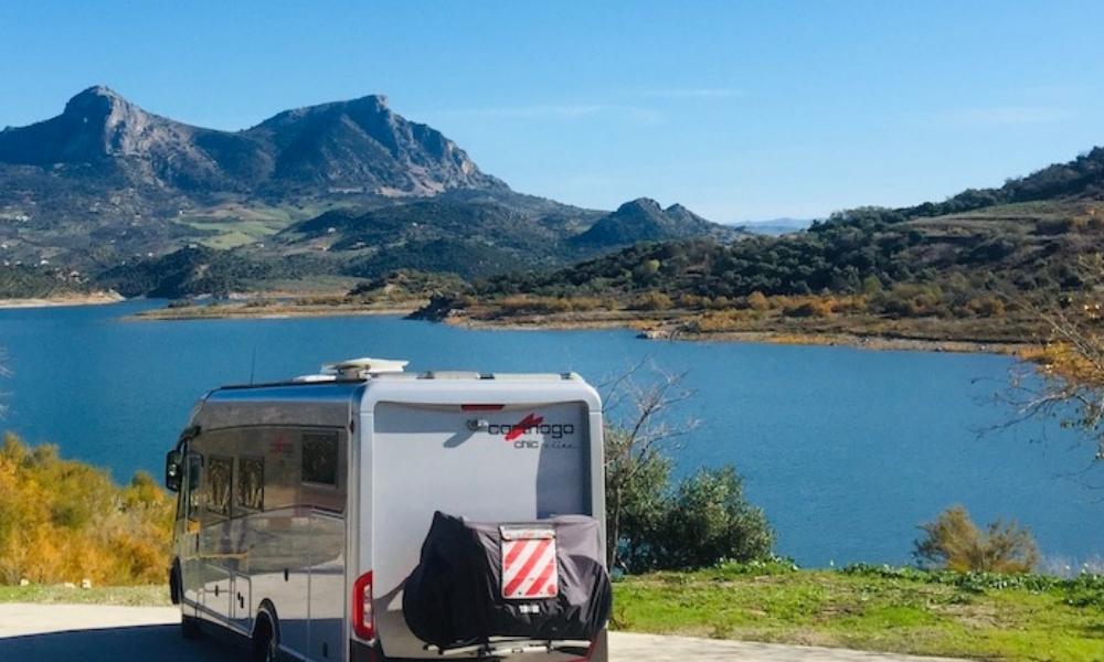 motorhome parked by a lake in Spain