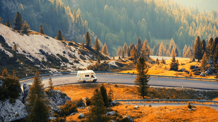 motorhome on mountain road amongst trees