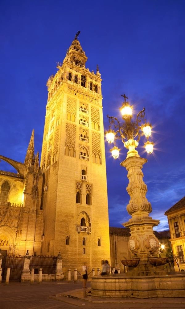 Giralda Bell Tower in Seville Spain lit up at night