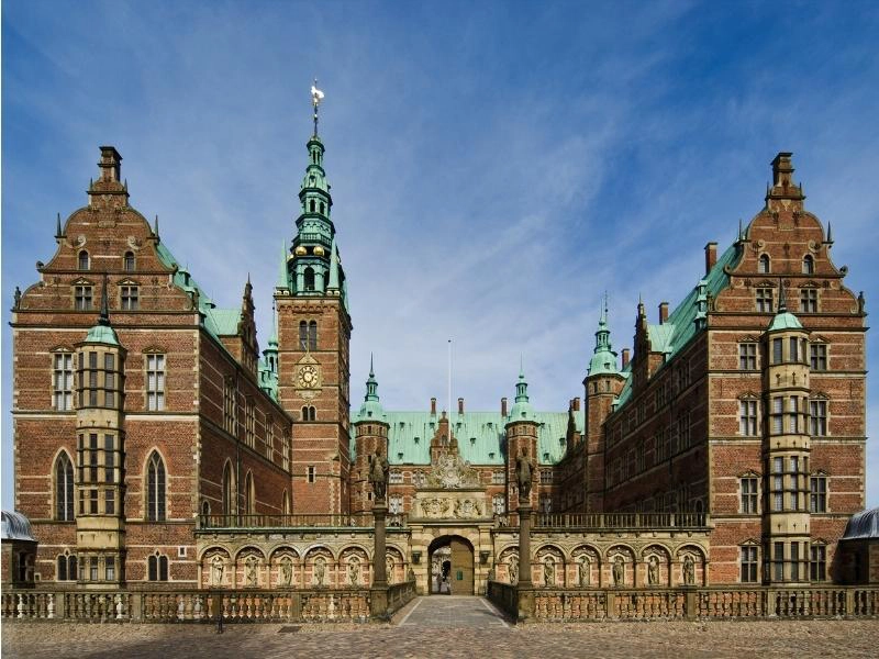 large Gothic palace with a copper roof
