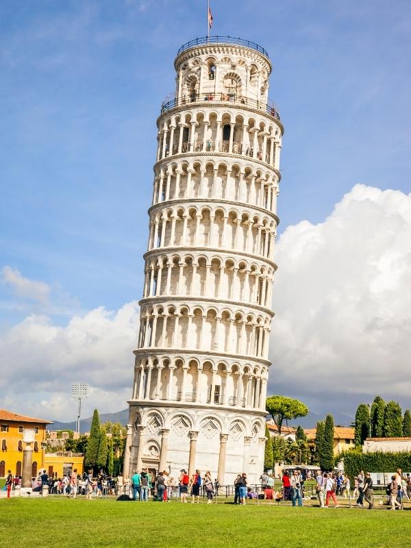 creamy stone leaning tower with eight stories and arched rows around each story