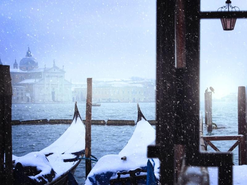 Venice with snow covered gondalas