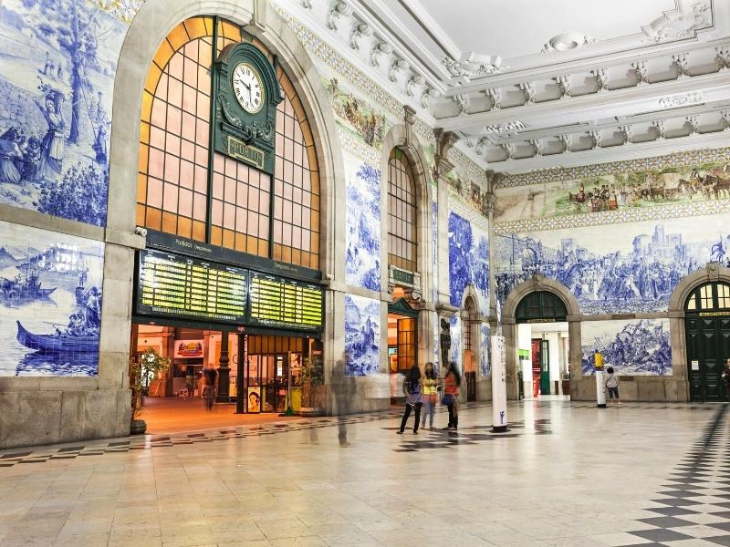 blue and white tiles in a public building with a clock