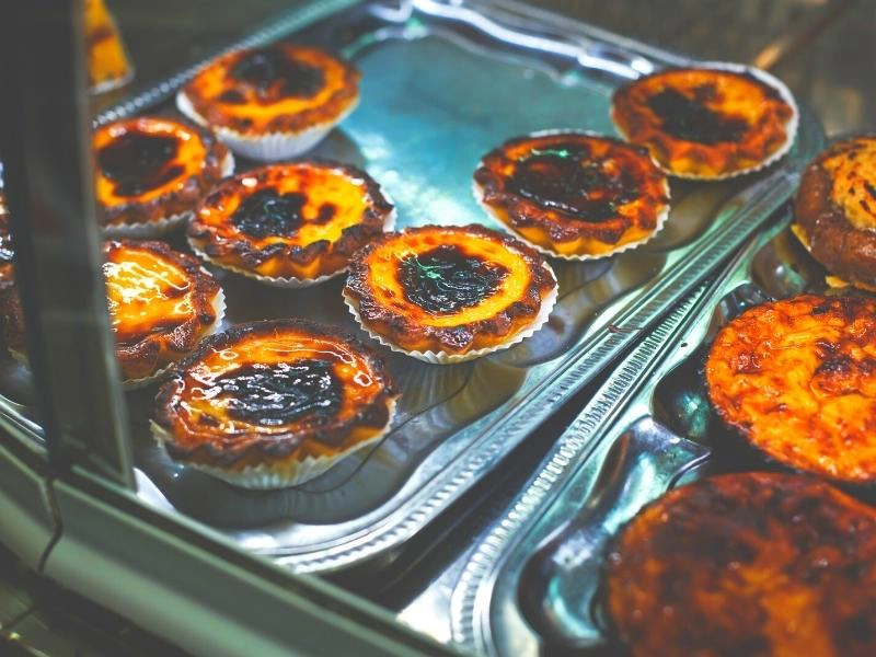 custard tarts on a silver tray