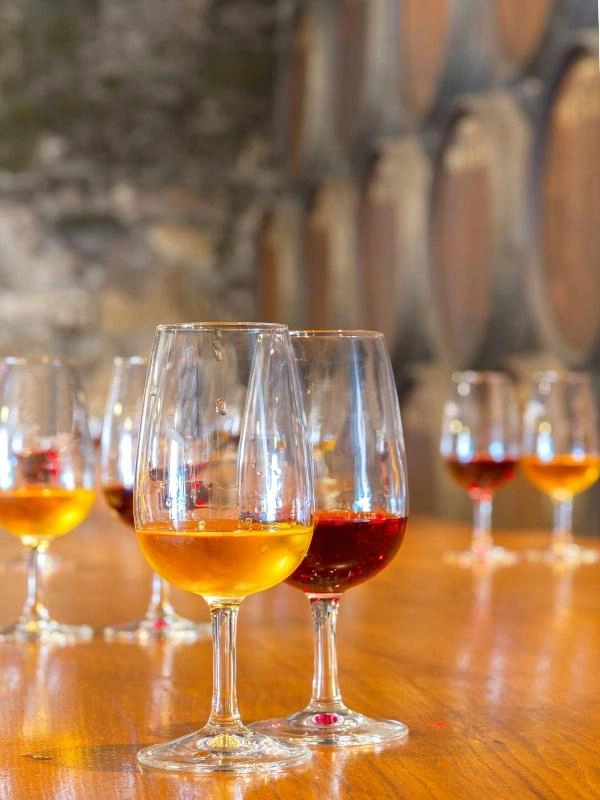 glasses of port on a wooden table