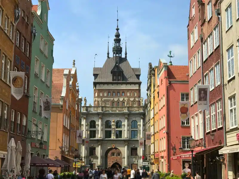 People in the street of Gdansk with the Golden Gate