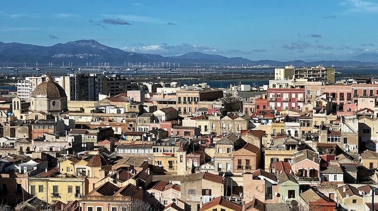 A view over the city of Cagliari on the island of Sardinia, to mountains and blue sky