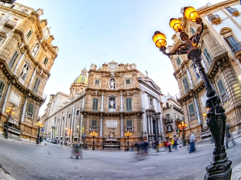 Intersection of roads in palermo with ornate buildings on all four corners