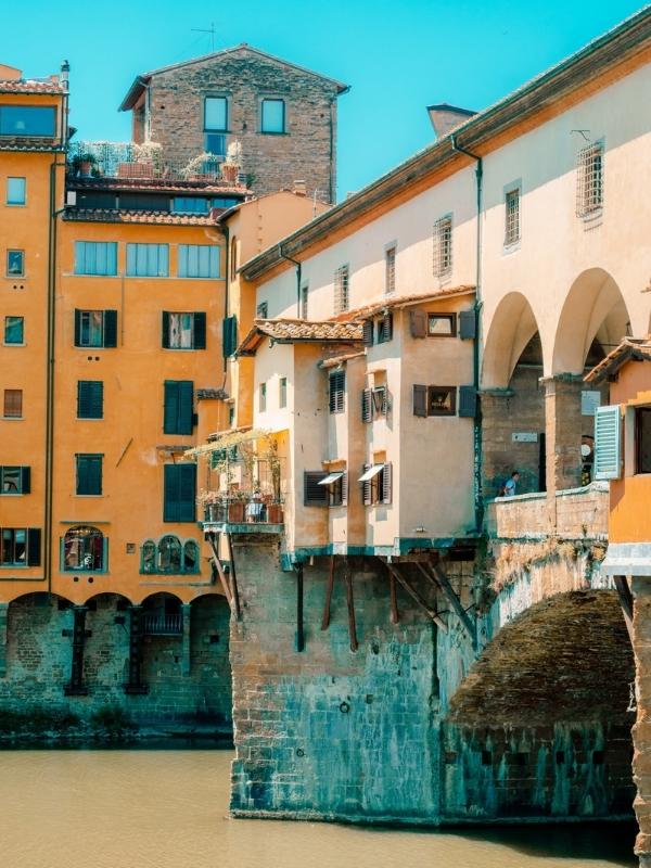 ancient bridge with houses built along the structure