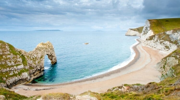 Stunning Durdle Door arch and beach during a road trip south west England