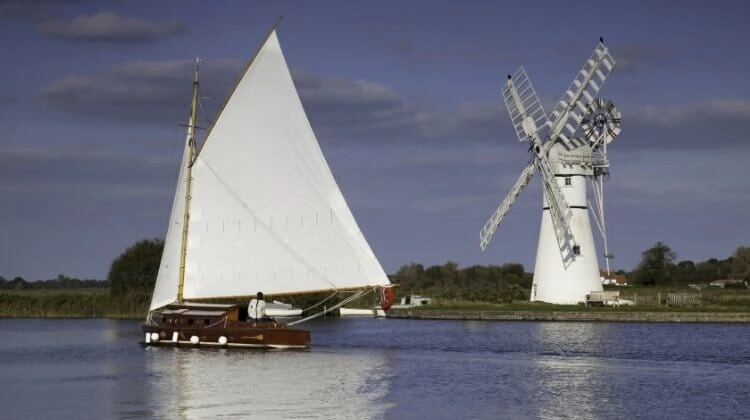 Wherry sailing barge and windmill in the Norfolk Broads