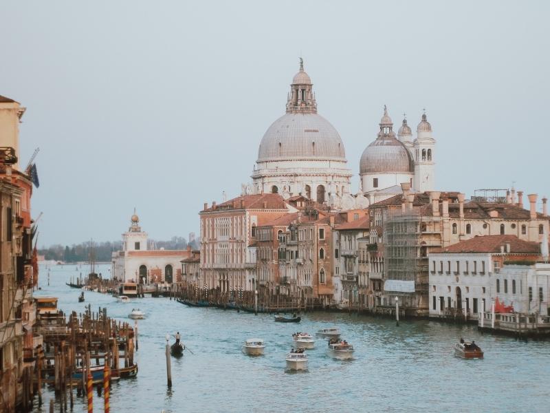 canal going past the historic buildings of Venice