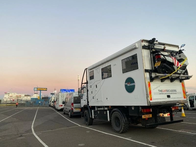 line of motorhomes waiting to board a ferry