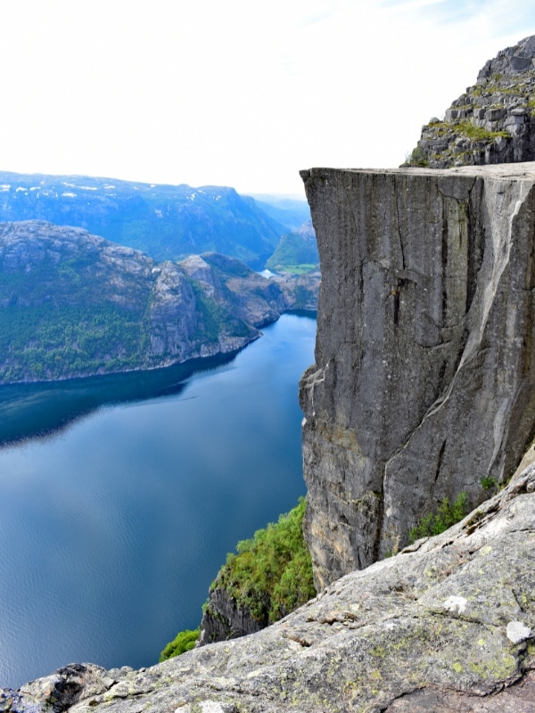 very high and sheer rock overlooking a Norwegian fjord