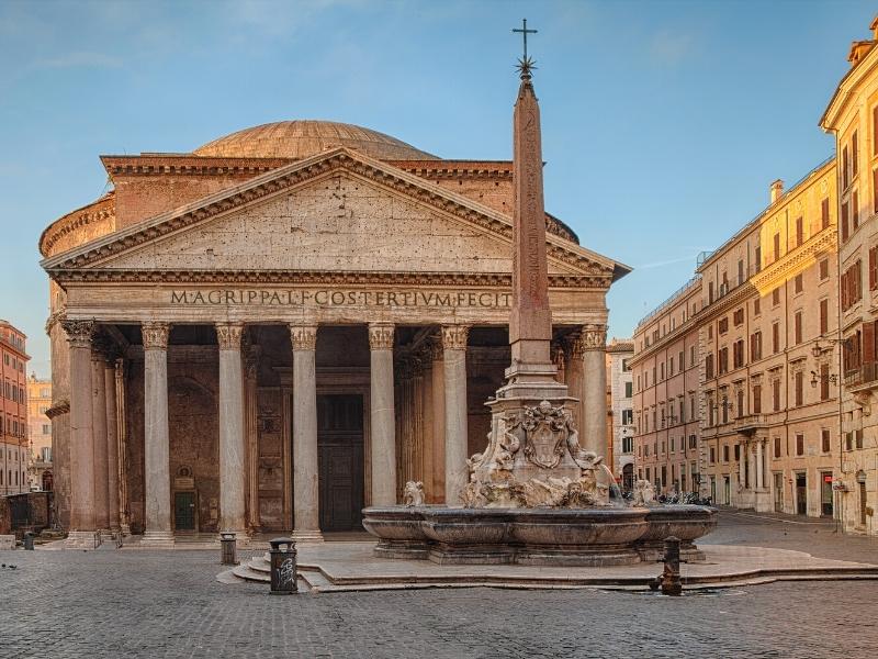 large building with Roman columns and dome, and a Roman insciption above the door