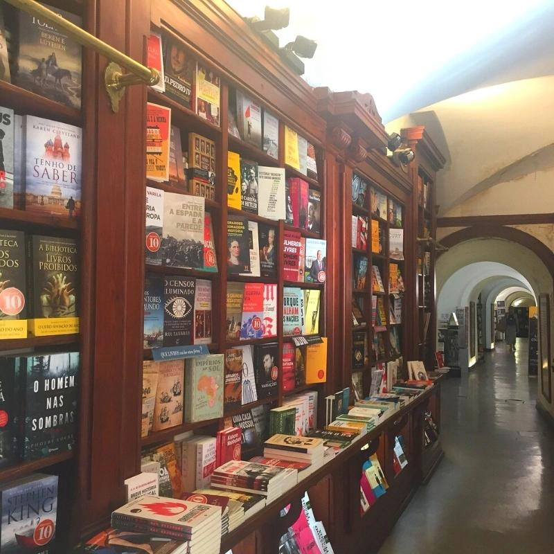 Brown wooden bookcases holding books 