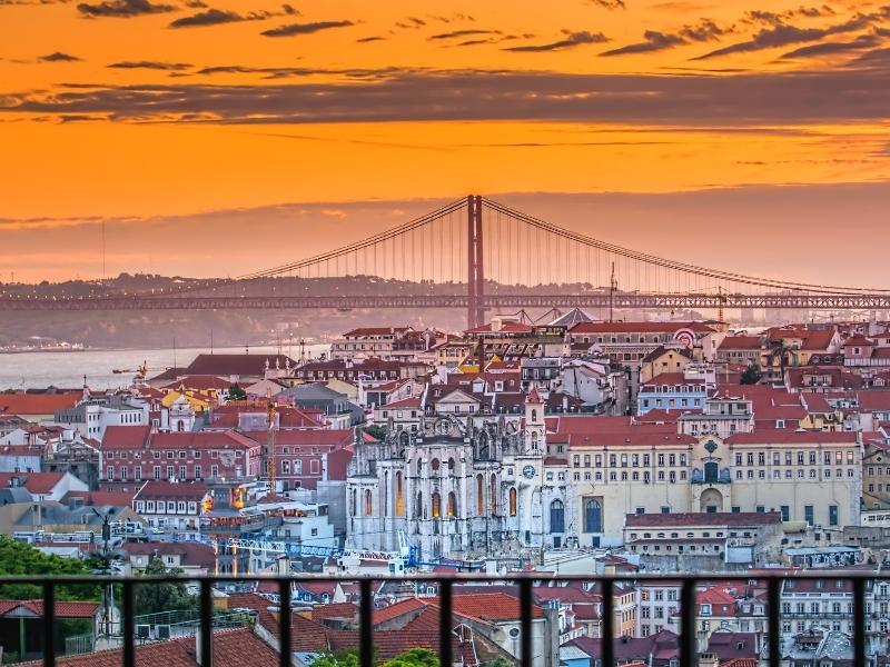 View across the city of Lisbon skyline at sunset