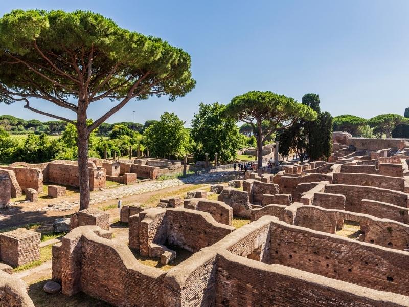 red brick walls and cypress trees in a Roman archeological site