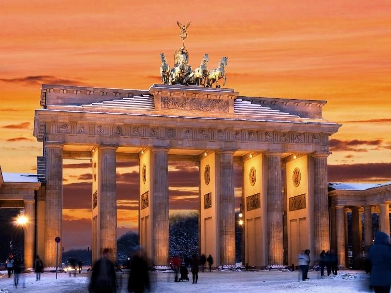Berlin Brandenburg Gate at sunset in the snow