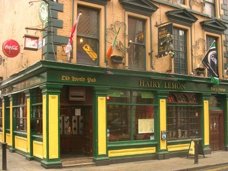 The green and yellow exterior of a traditional Irish pub in Dublin