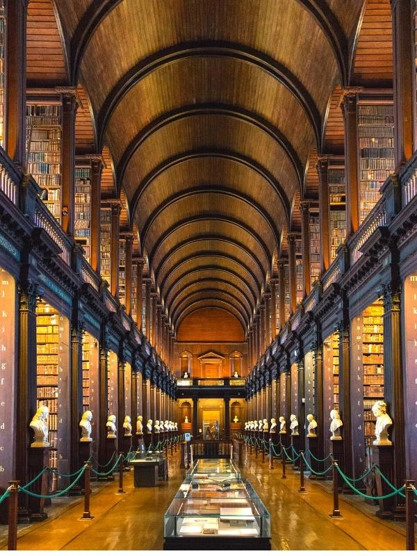 The long room library, with wooden panels and books on display