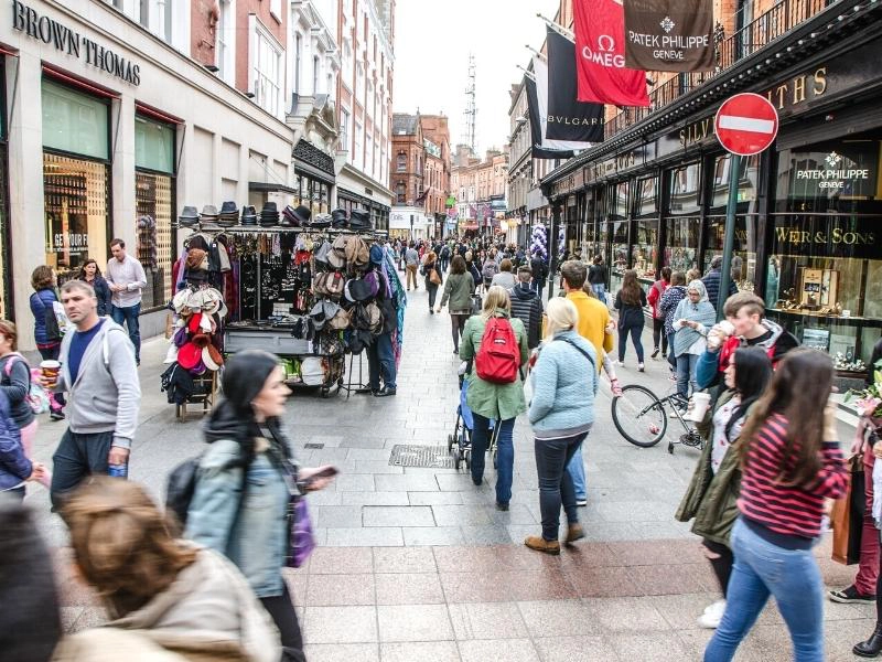 busy shopping street thronged with people