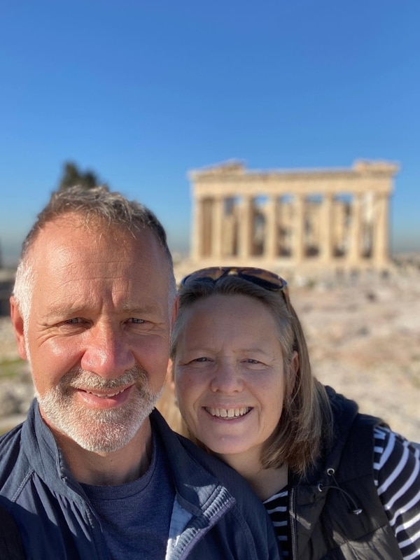 couple in front of an ancient stone building