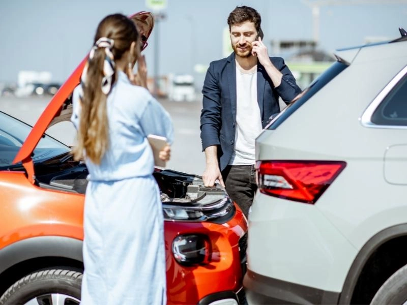 Two cars in a collisions with people talking on the phone