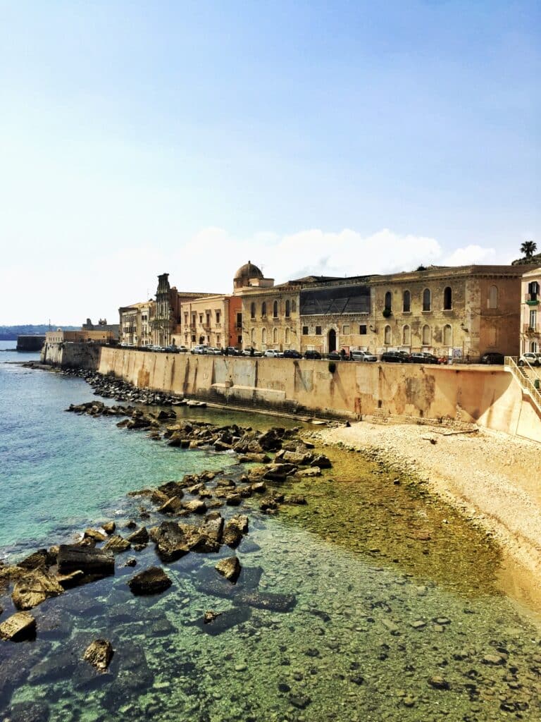 The old town of Ortigia seens from Spiaggia di Cala Rossa