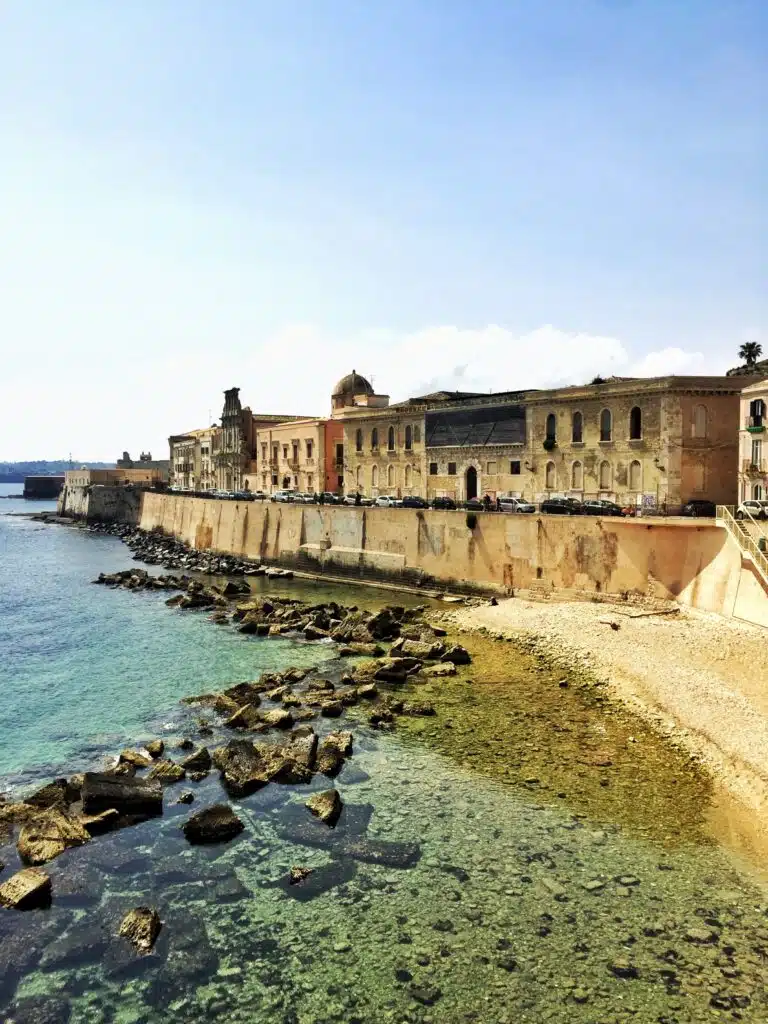 The old town of Ortigia seens from Spiaggia di Cala Rossa