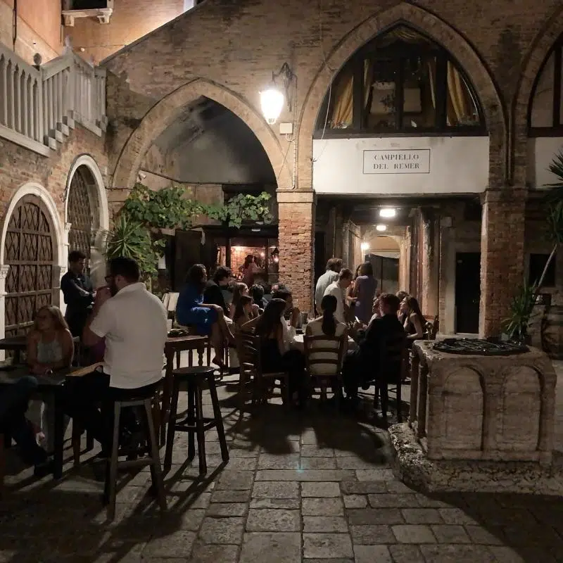 An image of a bar in Venice at night