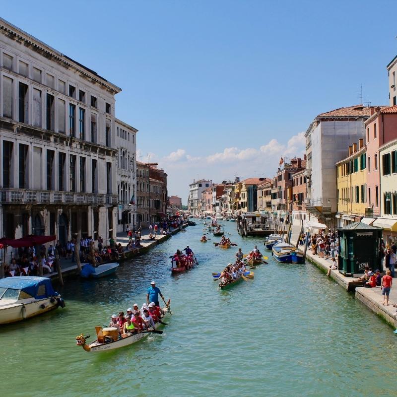 An image of dragon boats on the Grand Canal in Venice