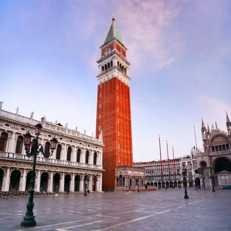 An image of the red brick St Mark's Campanile clock tower and some of St Mark's Square