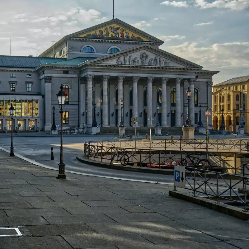 An image of the front of the National Theatre with its romanesque columns 
