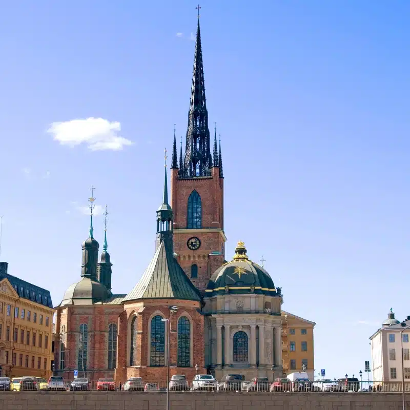 An image of a gothic church with a cast iron spire