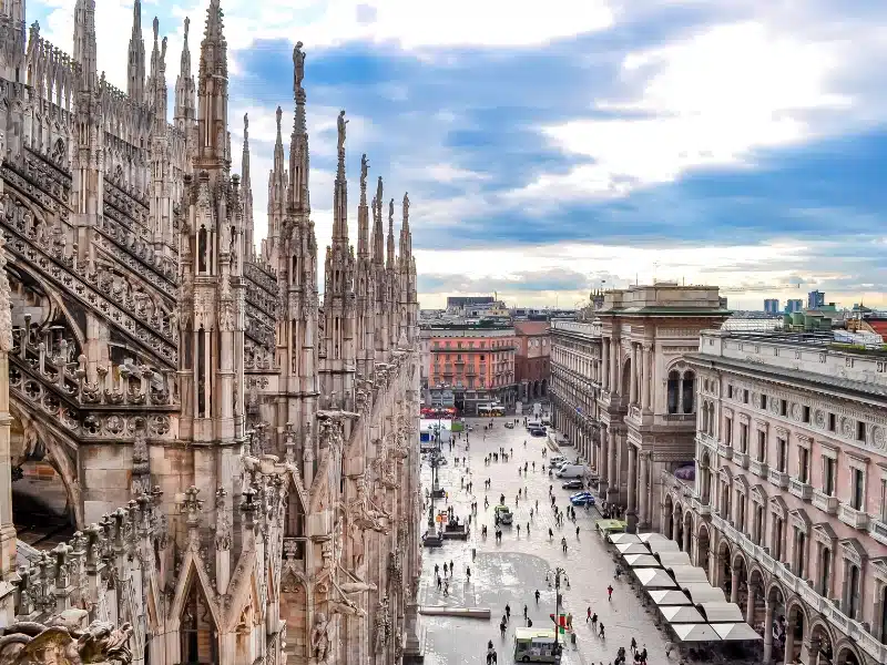 aerial view of a city square from the top of a gothic church with many spires