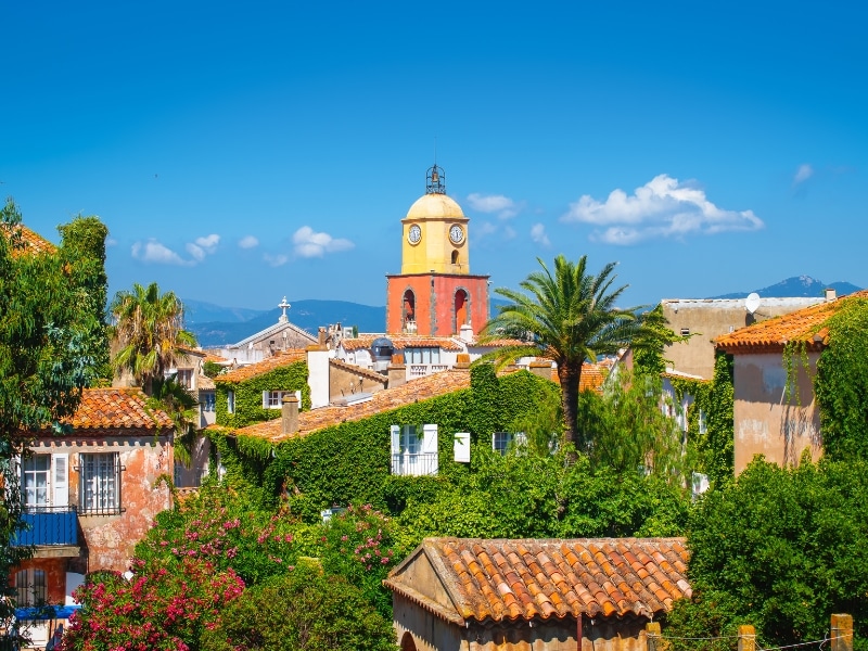 Bell tower across tiled roofs in Saint-Tropez, French Riviera.