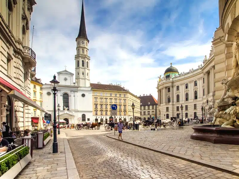 city square with hostirc buildings and cobbled streets