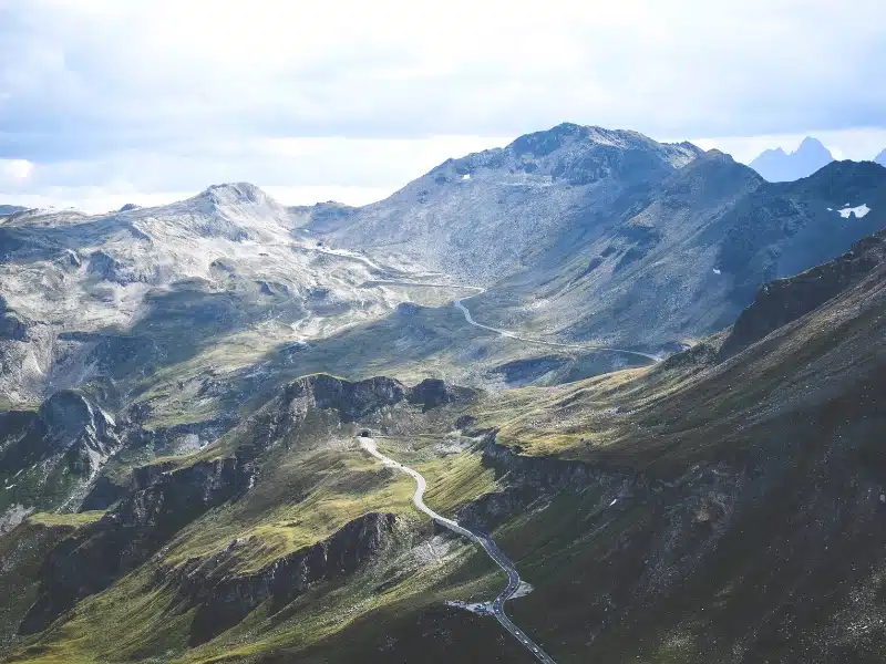 Winding road over snow dusted mountains in Austria